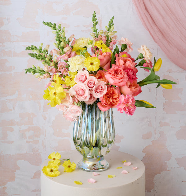 Sunburst floral arrangement with bold yellow and orange blooms