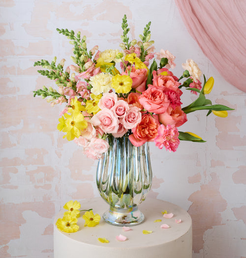 Sunburst floral arrangement with bold yellow and orange blooms