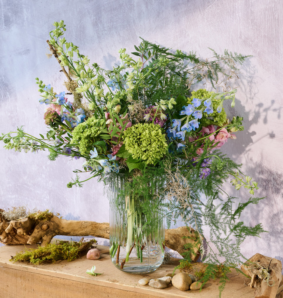 Meadow bouquet with lush seasonal wildflowers in a vase