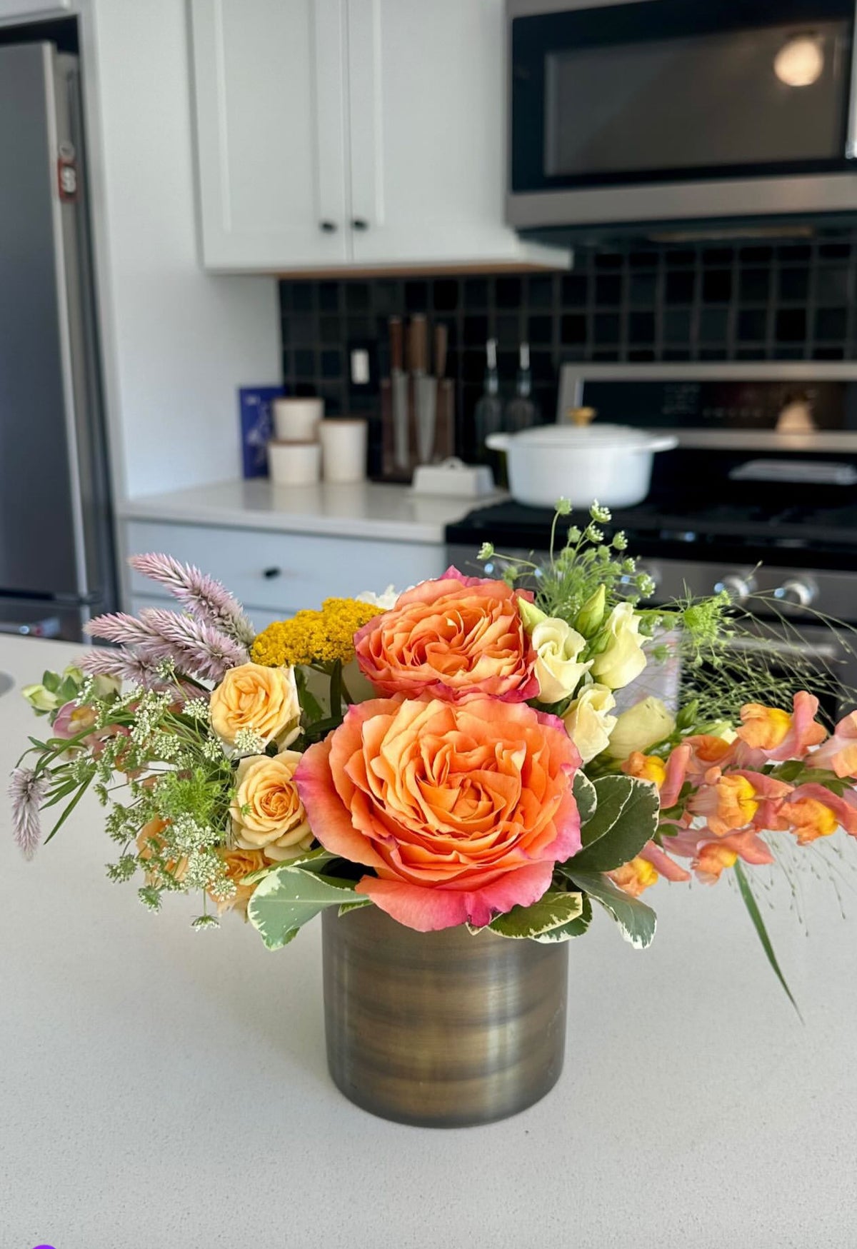 Fresh flower subscription delivery in vase on kitchen counter from Flowers for Dreams