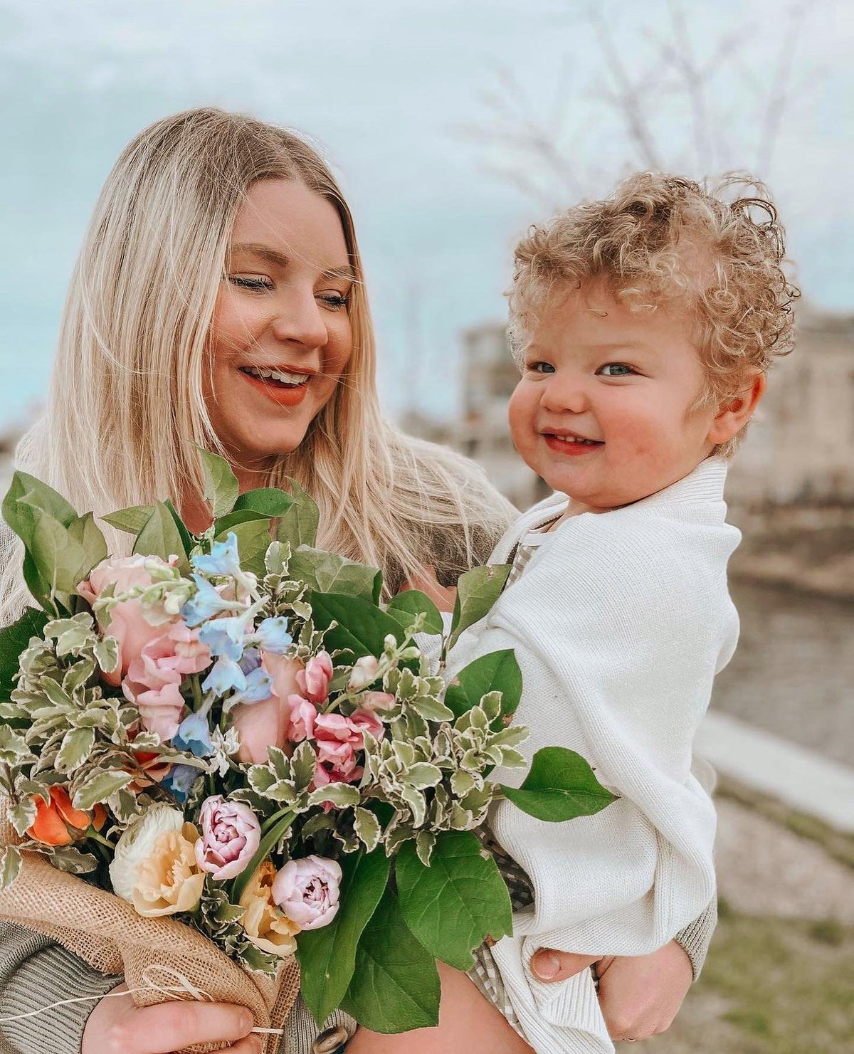 Mother and child with fresh bouquet from Flowers for Dreams floral subscription
