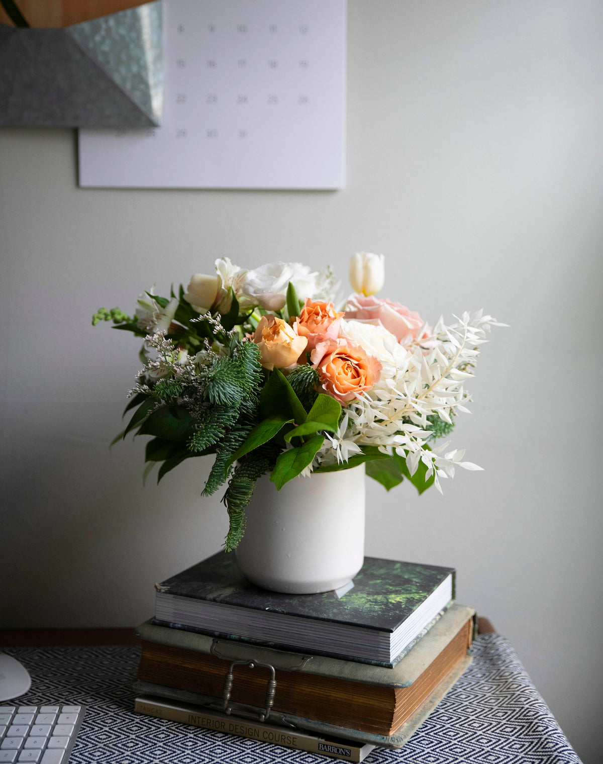 Flowers for Dreams subscription vase arrangement with roses and greenery on desk
