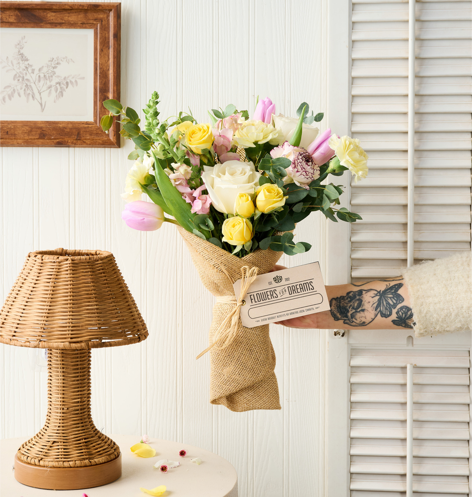 Daylight flower arrangement with warm-toned blooms